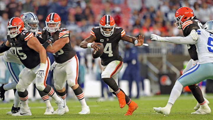 Cleveland Browns quarterback Deshaun Watson (4) runs for yards through the hole created by guard Joel Bitonio, left, center Ethan Pocic (55) and offensive tackle James Hudson III during the second half of an NFL football game at Huntington Bank Field, Sunday, Sept. 8, 2024, in Cleveland, Ohio.
