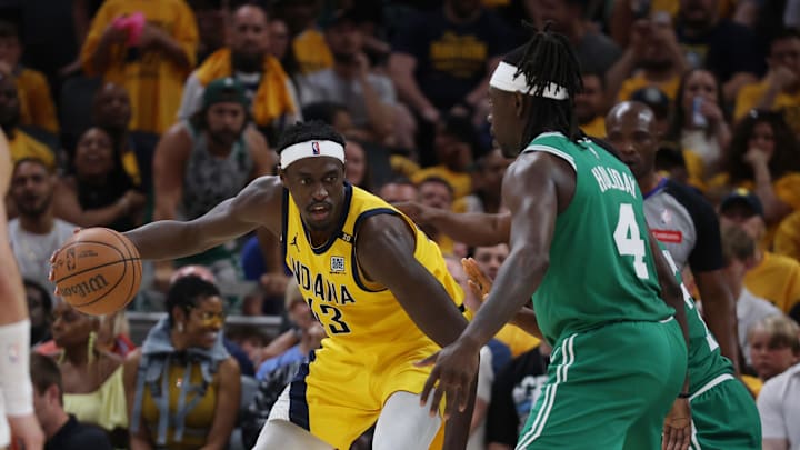May 25, 2024; Indianapolis, Indiana, USA; Indiana Pacers forward Pascal Siakam (43) controls the ball against Boston Celtics guard Jrue Holiday (4) during the fourth quarter of game three of the eastern conference finals in the 2024 NBA playoffs at Gainbridge Fieldhouse. Mandatory Credit: Trevor Ruszkowski-USA TODAY Sports