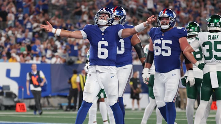 Aug 16, 2025; East Rutherford, New Jersey, USA; New York Giants quarterback Jaxson Dart (6) celebrates his rushing touchdown during the second half against the New York Jets at MetLife Stadium.  