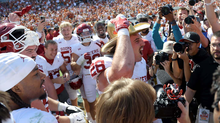 Oklahoma Sooners linebacker Danny Stutsman (28) celebrates with the Golden Hat Trophy after the Red River Rivalry college football game between the University of Oklahoma Sooners (OU) and the University of Texas (UT) Longhorns at the Cotton Bowl in Dallas, Saturday, Oct. 7, 2023. Oklahoma won 34-30.