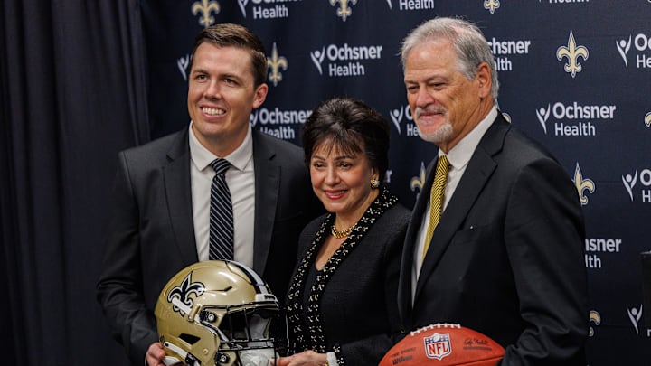 Feb 13, 2025; New Orleans, LA, USA;  New Orleans Saints owner Gayle Benson poses with head coach Kellen Moore and general manager Mickey Loomis at Ochsner Sports Performance Center. Mandatory Credit: Stephen Lew-Imagn Images