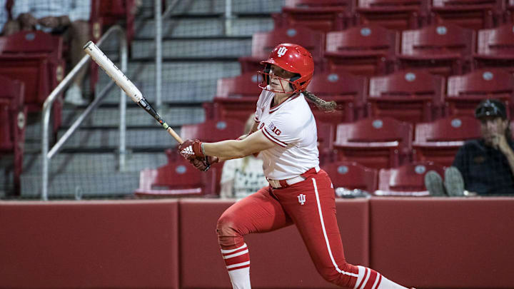 May 17, 2025; Fayetteville, AR, USA;  Indiana Hoosiers infielder Madalyn Strader (8) hits a single during the fifth inning against the Oklahoma State Cowgirls.  Oklahoma State won 16-8.  Mandatory Credit: Brett Rojo-Imagn Images