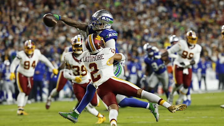 Nov 2, 2025; Landover, Maryland, USA;  Washington Commanders cornerback Marshon Lattimore (2) called for pass intereference against Seattle Seahawks wide receiver Jaxon Smith-Njigba (11) during the first quarter at Northwest Stadium. Mandatory Credit: Geoff Burke-Imagn Images