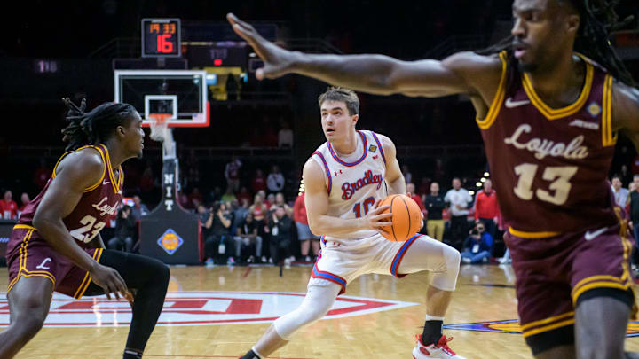 Bradley's Connor Hickman (10) eyes the basket as he maneuvers through the Loyola Chicago defense in Bradley's Connor Hickman (10) eyes the basket as he maneuvers through the Loyola Chicago defense in