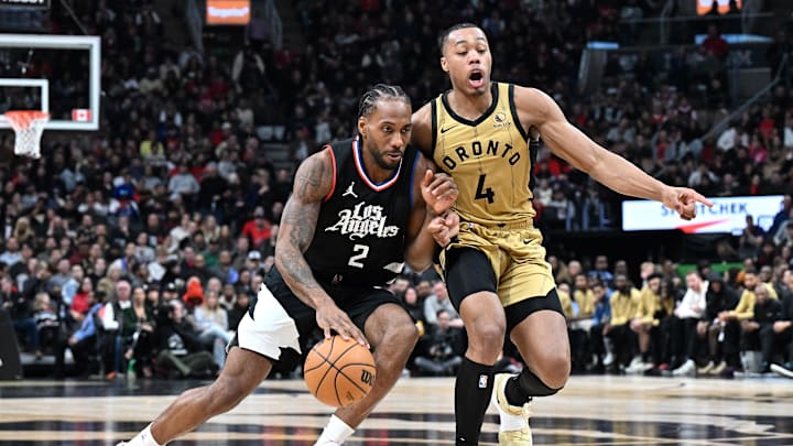 Jan 26, 2024; Toronto, Ontario, CAN;   Los Angeles Clippers forward Kawhi Leonard (2) dribbles the ball against Toronto Raptors forward Scottie Barnes (4) in the second half at Scotiabank Arena. Mandatory Credit: Dan Hamilton-Imagn Images