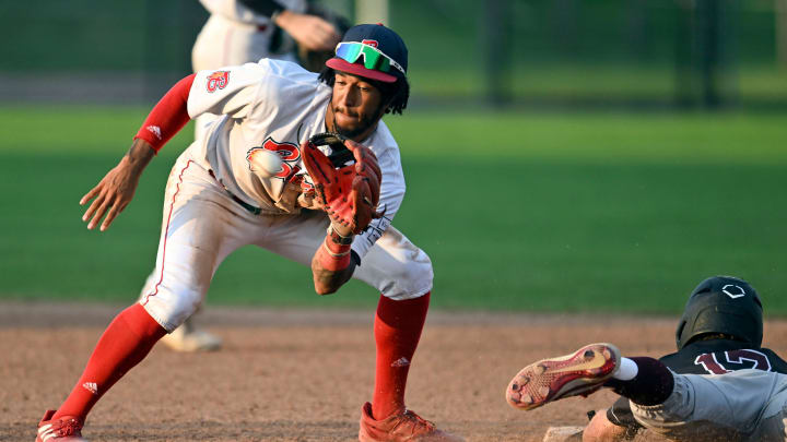 BOURNE   07/13/23   John Spikerman of Falmouth dives safely into second as Josh Kuroda-Grauer of Bourne takes the throw.
