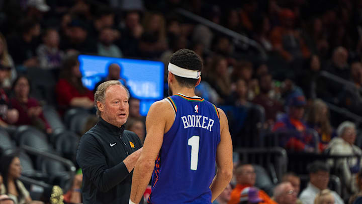 Phoenix Suns guard Devin Booker (1)  and coach Mike Budenholzer.