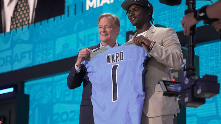 Cam Ward, QB, from Miami holds a jersey with NFL Commissioner Roger Goodell after being selected 1st overall by the Tennessee Titans during the first round of the 2025 NFL Draft at Lambeau Field on April 24, 2025 in Green Bay, Wisconsin.