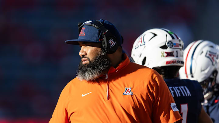 Nov 8, 2025; Tucson, Arizona, USA; Arizona Wildcats assistant coach Lyle Moevao against the Kansas Jayhawks at Arizona Stadium. Mandatory Credit: Mark J. Rebilas-Imagn Images