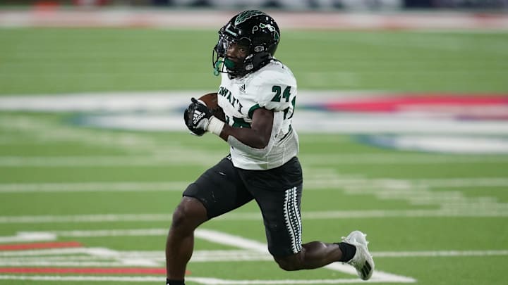 Nov 5, 2022; Fresno, California, USA; Hawaii Rainbow Warriors running back Tylan Hines (24) runs the ball against the Fresno State Bulldogs in the fourth quarter at Valley Children's Stadium. Mandatory Credit: Cary Edmondson-Imagn Images