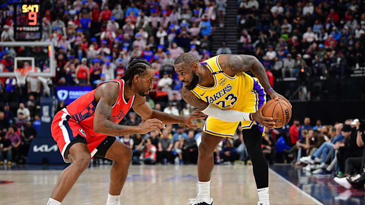 Feb 4, 2025; Inglewood, California, USA; Los Angeles Lakers forward LeBron James (23) controls the ball against Los Angeles Clippers forward Kawhi Leonard (2) during the second half at Intuit Dome. Mandatory Credit: Gary A. Vasquez-Imagn Images