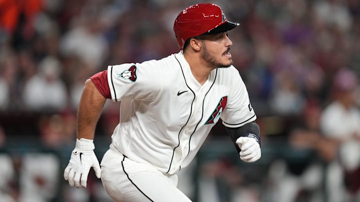 Arizona Diamondbacks' Nolan Arenado (28) hits a single against the Detroit Tigers at Chase Field on March 30, 2026.