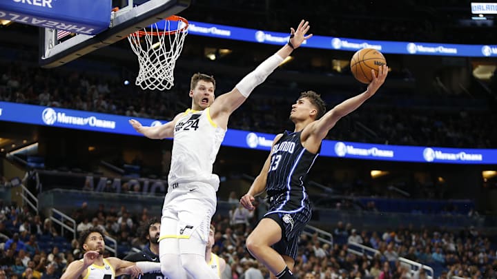 Jan 5, 2025; Orlando, Florida, USA;  Orlando Magic forward Tristan da Silva (23) takes a shot as Utah Jazz center Walker Kessler (24) defends at Kia Center. Mandatory Credit: Russell Lansford-Imagn Images