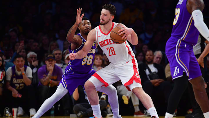 Apr 29, 2026; Los Angeles, California, USA; Houston Rockets center Alperen Sengun (28) moves the ball against Los Angeles Lakers guard Marcus Smart (36) during the first half in game five of the first round of the 2026 NBA Playoffs at Crypto.com Arena. Mandatory Credit: Gary A. Vasquez-Imagn Images
