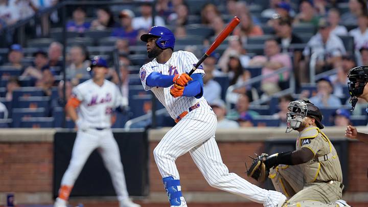 Aug 17, 2026; New York City, New York, USA; New York Mets center fielder Luis Robert Jr. (88) follows through on an RBI sacrifice fly against the San Diego Padres during the first inning at Citi Field. Mandatory Credit: Brad Penner-Imagn Images