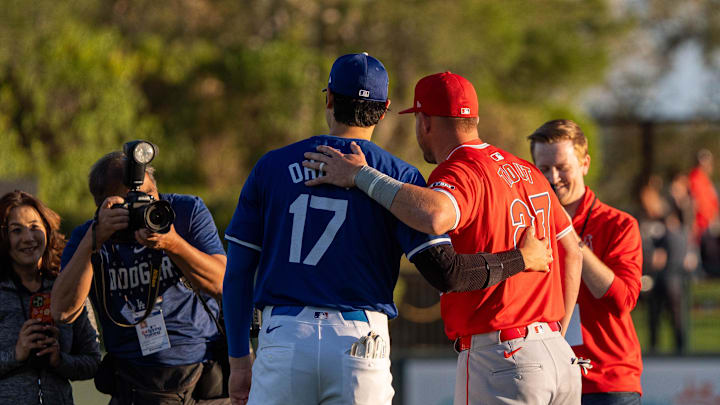 Mar 5, 2024; Phoenix, Arizona, USA;  Los Angeles Dodgers two-way player Shohei Ohtani (17) and Los Angeles Angels outfielder Mike Trout  (27) pose for a photo before the start of a spring training game at Camelback Ranch-Glendale. Mandatory Credit: Allan Henry-Imagn Images