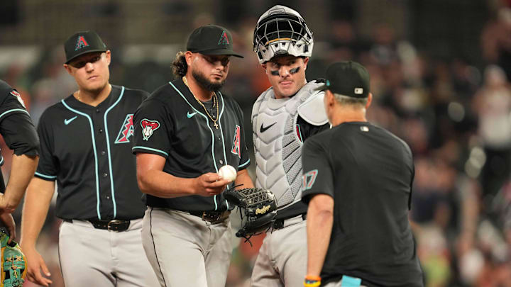 Apr 14, 2026; Baltimore, Maryland, USA; Arizona Diamondbacks pitcher Juan Morillo (left) is removed from the game in the eighth inning by manager Torey Lovullo (right) against the Baltimore Orioles at Oriole Park at Camden Yards. Mandatory Credit: Mitch Stringer-Imagn Images