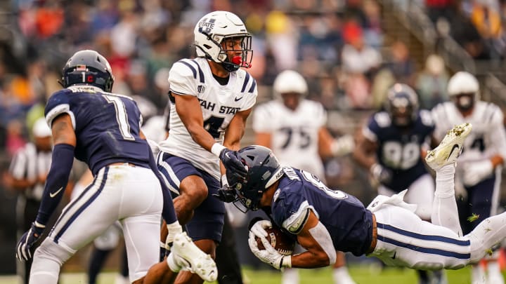 Sep 30, 2023; East Hartford, Connecticut, USA; UConn Huskies linebacker Jackson Mitchell (8) intercepts a pass intended for Utah State Aggies wide receiver Micah Davis (4) in the first quarter at Rentschler Field at Pratt & Whitney Stadium. Mandatory Credit: David Butler II-USA TODAY Sports Sep 30, 2023; East Hartford, Connecticut, USA; UConn Huskies linebacker Jackson Mitchell (8) intercepts a pass intended for Utah State Aggies wide receiver Micah Davis (4) in the first quarter at Rentschler Field at Pratt & Whitney Stadium. Mandatory Credit: David Butler II-USA TODAY Sports