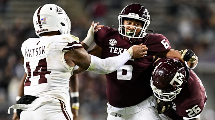Nov 11, 2023; College Station, Texas, USA; Texas A&M Aggies tight end Jaden Platt (6) and Mississippi State Bulldogs linebacker Nathaniel Watson (14) in action during the second half at Kyle Field. Mandatory Credit: Maria Lysaker-Imagn Images