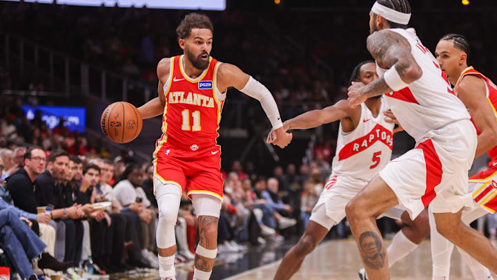 Oct 22, 2025; Atlanta, Georgia, USA; Atlanta Hawks guard Trae Young (11) dribbles against the Toronto Raptors in the first quarter at State Farm Arena. Mandatory Credit: Brett Davis-Imagn Images
