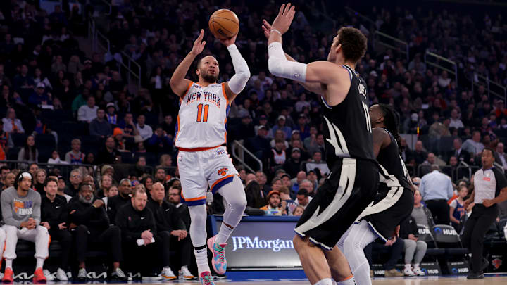 Jan 12, 2025; New York, New York, USA; New York Knicks guard Jalen Brunson (11) takes a shot against Milwaukee Bucks center Brook Lopez (11) during the first quarter at Madison Square Garden. Mandatory Credit: Brad Penner-Imagn Images