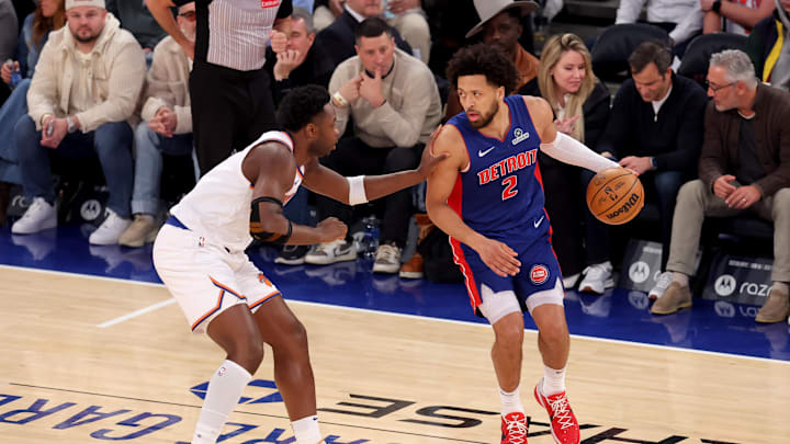 Jan 13, 2025; New York, New York, USA; Detroit Pistons guard Cade Cunningham (2) controls the ball against New York Knicks forward OG Anunoby (8) during the first quarter at Madison Square Garden. Mandatory Credit: Brad Penner-Imagn Images