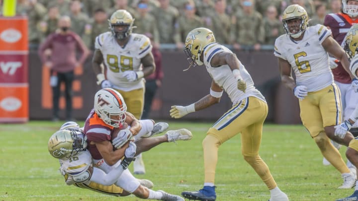 Nov 5, 2022; Blacksburg, Virginia, USA;   Virginia Tech Hokies wide receiver Jadan Blue (2) gets tackled by  tackled by Georgia Tech Yellow Jackets defensive back KJ Wallace (16) in the second half at Lane Stadium. Mandatory Credit: Lee Luther Jr.-USA TODAY Sports