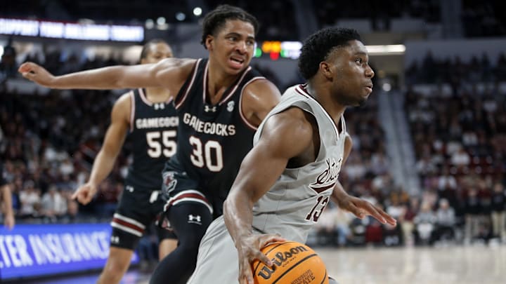 Mar 9, 2024; Starkville, Mississippi, USA; Mississippi State Bulldogs guard Josh Hubbard (13) drives to the basket around South Carolina Gamecocks forward Collin Murray-Boyles (30) during over-time at Humphrey Coliseum. Mandatory Credit: Petre Thomas-Imagn Images Mar 9, 2024; Starkville, Mississippi, USA; Mississippi State Bulldogs guard Josh Hubbard (13) drives to the basket around South Carolina Gamecocks forward Collin Murray-Boyles (30) during over-time at Humphrey Coliseum. Mandatory Credit: Petre Thomas-Imagn Images