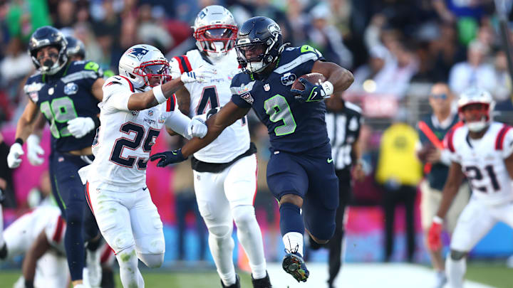 Feb 8, 2026; Santa Clara, CA, USA; Seattle Seahawks running back Kenneth Walker III (9) runs against New England Patriots cornerback Marcus Jones (25) during the second quarter in Super Bowl LX