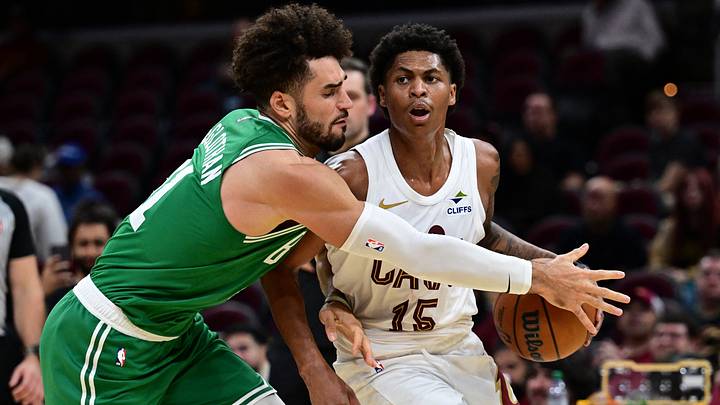 Oct 8, 2026; Cleveland, Ohio, USA;  Cleveland Cavaliers guard Meleek Thomas (15) drives on Boston Celtics forward Gabe McGlothan (41) during the second half of a preseason game at Rocket Arena.  Mandatory Credit: David Dermer-Imagn Images