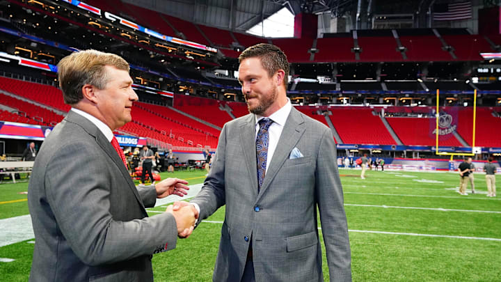 Sep 3, 2022; Atlanta, Georgia, USA;  Georgia Bulldogs head coach Kirby Smart greets Oregon Ducks head coach Dan Lanning midfield before the Chick-fil-A kickoff game at Mercedes-Benz Stadium. Mandatory Credit: John David Mercer-Imagn Images