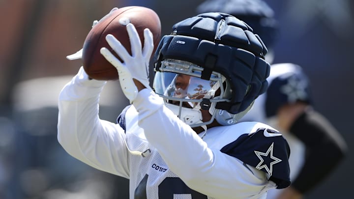 Jul 31, 2024; Oxnard, CA, USA; Dallas Cowboys running back Deuce Vaughn (42) makes a catch during training camp at the River Ridge Playing Fields in Oxnard, California.  Mandatory Credit: Jason Parkhurst-Imagn Images