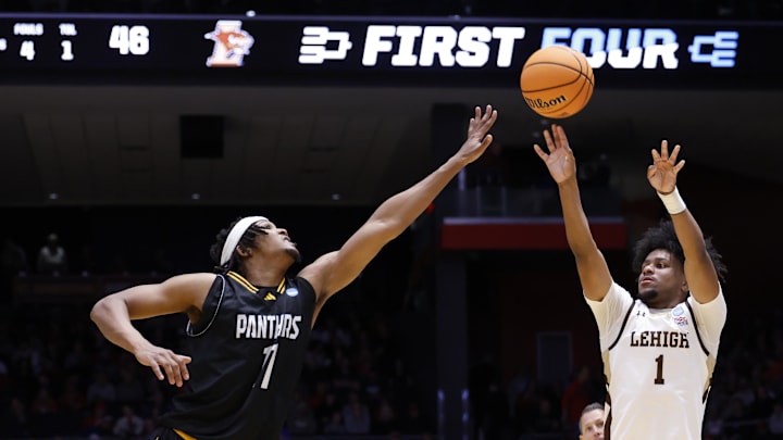 Mar 18, 2026; Dayton, OH, USA; Lehigh Mountain Hawks guard Nasir Whitlock (1) shoots the ball over Prairie View A&M Panthers forward Hassane Diallo (11) in the second half during a first four game of the men's 2026 NCAA Tournament at University of Dayton Arena. Mandatory Credit: Rick Osentoski-Imagn Images