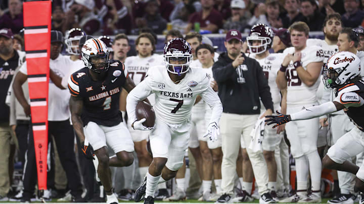 Dec 27, 2023; Houston, TX, USA; Texas A&M Aggies wide receiver Moose Muhammad III (7) runs with