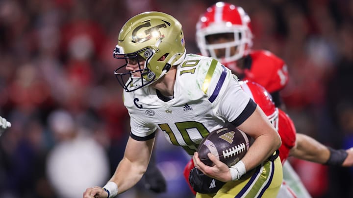 Nov 29, 2024; Athens, Georgia, USA; Georgia Tech Yellow Jackets quarterback Haynes King (10) runs the ball against the Georgia Bulldogs in the third quarter at Sanford Stadium. Mandatory Credit: Brett Davis-Imagn Images