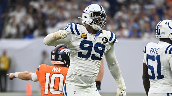 Sep 14, 2025; Indianapolis, Indiana, USA; Indianapolis Colts defensive tackle DeForest Buckner (99) celebrates a tackle against Denver Broncos quarterback Bo Nix (10) during the fourth quarter at Lucas Oil Stadium. 