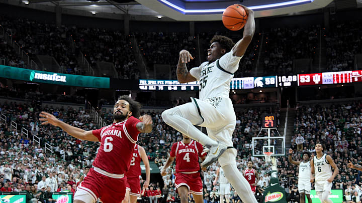 Jan 13, 2026; East Lansing, Michigan, USA;  Michigan State Spartans forward Coen Carr (55)shoots the ball over Indiana Hoosiers guard Tayton Conerway (6) during the second half at Jack Breslin Student Events Center. Mandatory Credit: Dale Young-Imagn Images