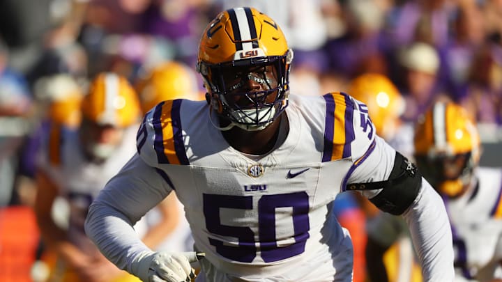 Nov 16, 2024; Gainesville, Florida, USA; LSU Tigers offensive lineman Emery Jones Jr. (50) warms up prior to the game against the Florida Gators at Ben Hill Griffin Stadium. 