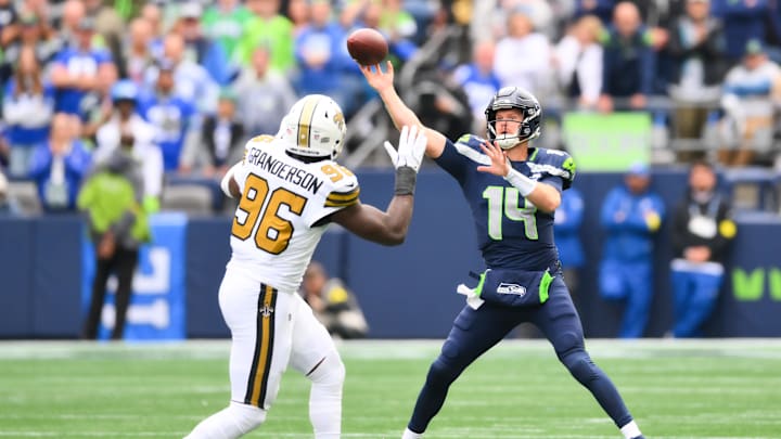 Sep 21, 2025; Seattle, Washington, USA; Seattle Seahawks quarterback Sam Darnold (14) throws the ball against the New Orleans Saints during the first quarterat Lumen Field. Mandatory Credit: Steven Bisig-Imagn Images