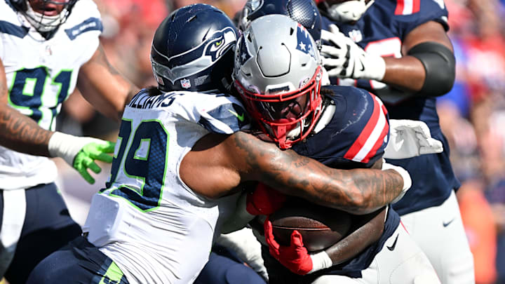 Sep 15, 2024; Foxborough, Massachusetts, USA; New England Patriots running back Rhamondre Stevenson (38) rushes against Seattle Seahawks defensive end Leonard Williams (99) for a touchdown during the second half at Gillette Stadium. Mandatory Credit: Brian Fluharty-Imagn Images Sep 15, 2024; Foxborough, Massachusetts, USA; New England Patriots running back Rhamondre Stevenson (38) rushes against Seattle Seahawks defensive end Leonard Williams (99) for a touchdown during the second half at Gillette Stadium. Mandatory Credit: Brian Fluharty-Imagn Images