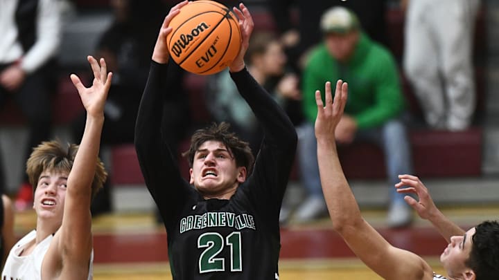 Greeneville's Trey Thompson (21) grabs the rebound during a high school basketball game between Greeneville and Bearden on Friday, December 16, 2022 in Knoxville, Tenn. Greeneville's Trey Thompson (21) grabs the rebound during a high school basketball game between Greeneville and Bearden on Friday, December 16, 2022 in Knoxville, Tenn.