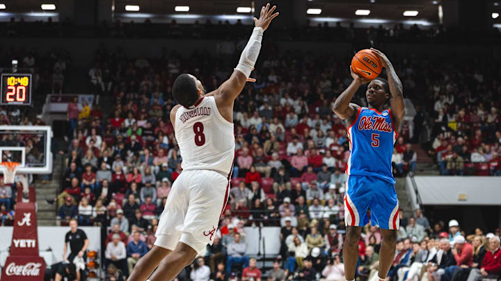 Jan 14, 2025; Tuscaloosa, Alabama, USA; Alabama Crimson Tide guard Chris Youngblood (8) attempts to block a shot by Mississippi Rebels guard Jaylen Murray (5) during the second half at Coleman Coliseum. Mandatory Credit: Will McLelland-Imagn Images