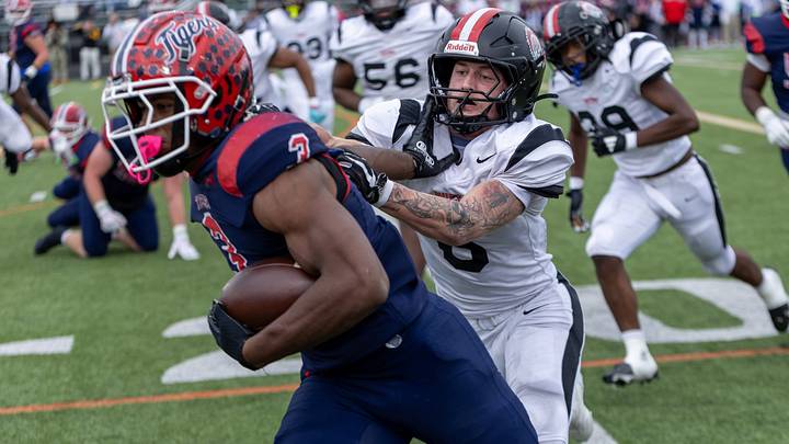 Aliquippa linebacker JJ Work (6) looks to drag down McKeesport running back Kemon Spell (3) in the first half of the WPIAL Class 4A championship game between Aliquippa and McKeesport Saturday, Nov. 15, 2025 at Pine-Richland Stadium in Gibsonia, Pa.