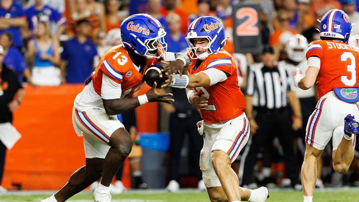 Sep 12, 2026; Gainesville, Florida, USA; Florida Gators quarterback Aaron Philo (12) hands the ball to Florida Gators quarterback Aaron Philo (12) against the Campbell Fighting Camels during the second half at Ben Hill Griffin Stadium. Mandatory Credit: Matt Pendleton-Imagn Images