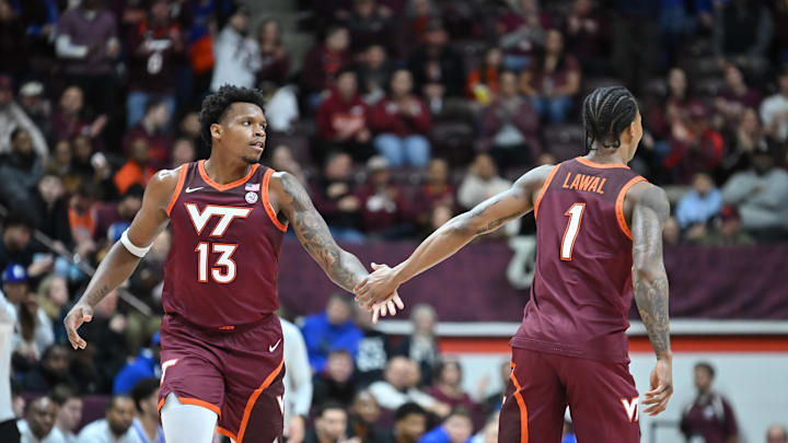 Jan 31, 2026; Blacksburg, Virginia, USA;  Virginia Tech Hokies forward Tobi Lawal (1) congratulates Virginia Tech Hokies forward Amani Hansberry (13) on a basket during the first half at Cassell Coliseum. Mandatory Credit: Brian Bishop-Imagn Images