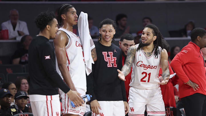 Dec 13, 2025; Houston, Texas, USA; Houston Cougars guard Emanuel Sharp (21) reacts from the bench during the second half against the New Orleans Privateers at Fertitta Center. Mandatory Credit: Troy Taormina-Imagn Images