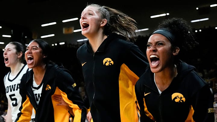 Iowa center Ava Heiden (5), Iowa forward Jada Gyamfi (23), Iowa guard Teagan Mallegni (55), and Iowa guard Kennise Johnson (13) react during a game against the Drake Bulldogs Nov. 13, 2025 at Carver-Hawkeye Arena in Iowa City, Iowa.