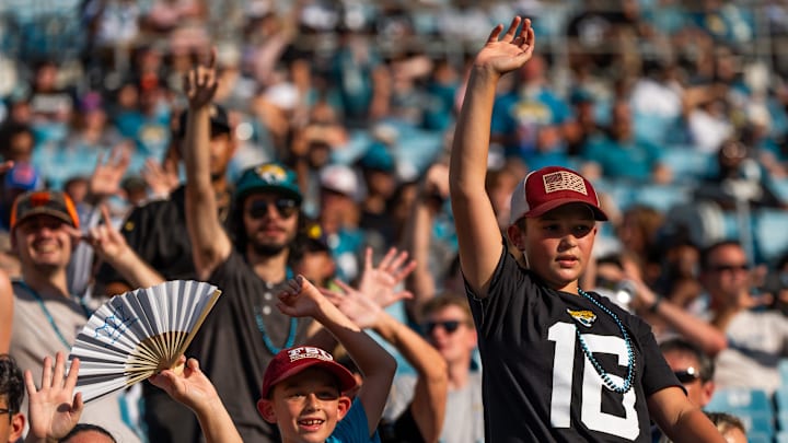Jaguar fans wave to their favorite player before an NFL scrimmage at EverBank Stadium Friday August 1, 2025, in Jacksonville, Fla. [Doug Engle/Florida Times-Union]