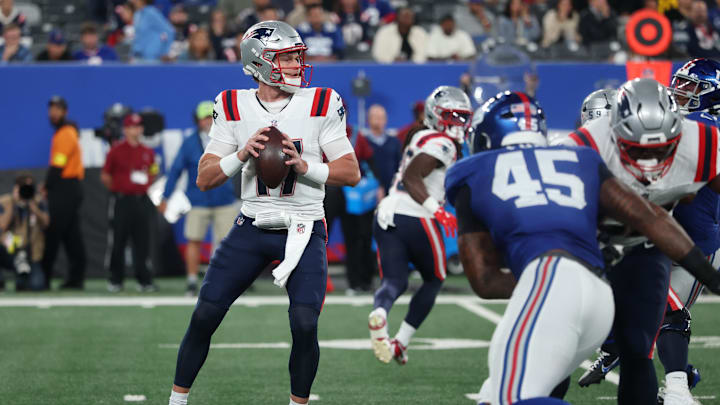 Aug 21, 2025; East Rutherford, New Jersey, USA; New England Patriots quarterback Ben Wooldridge (17) drops back to pass  during the first quarter against the New York Giants at MetLife Stadium. Mandatory Credit: Vincent Carchietta-Imagn Images