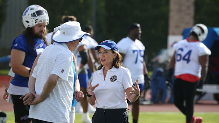 New York Governor Kathy Hochul visits with Bills owner Terry Pegula and his daughter Laura Pegula during her visit to the team’s training camp during the second day of Buffalo Bills training camp at St. John Fisher University Thursday, July 24, 2025 in Pittsford. New York Governor Kathy Hochul visits with Bills owner Terry Pegula and his daughter Laura Pegula during her visit to the team’s training camp during the second day of Buffalo Bills training camp at St. John Fisher University Thursday, July 24, 2025 in Pittsford.